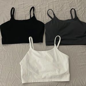Three athletic tops built in shelf bra